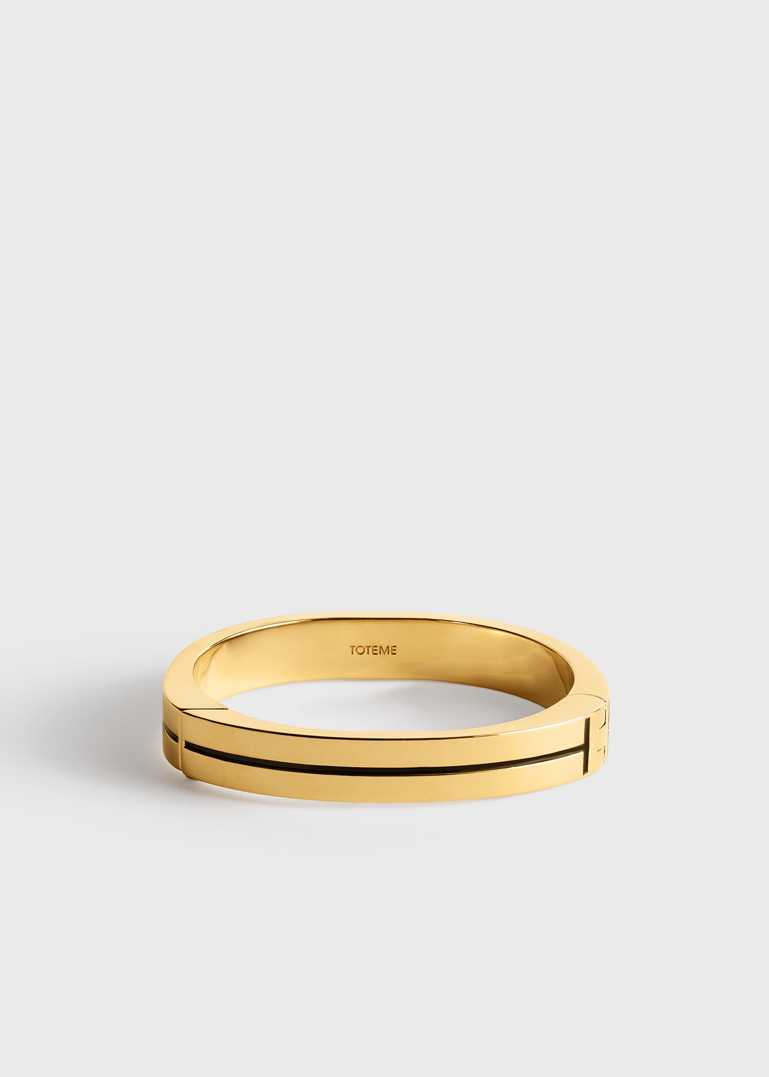 Toteme Studio Signature stripe bracelet black/gold