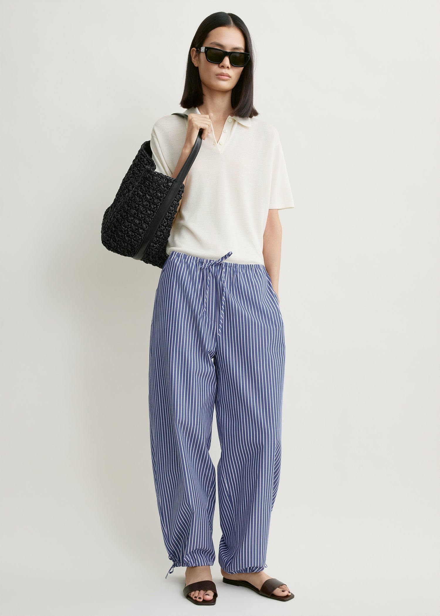 Toteme Studio Striped drawstring cotton trousers ink blue/pink stripe