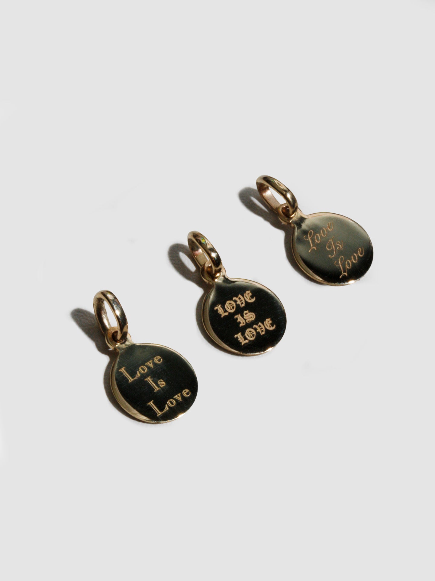 Lorenstewart 'Love Is Love' Mini Disk Pendant