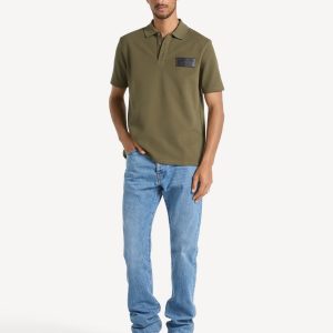 Polo en coton avec étiquette Balmain Vintage en cuir